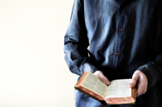 stock-photo-48225788-man-holding-open-bible